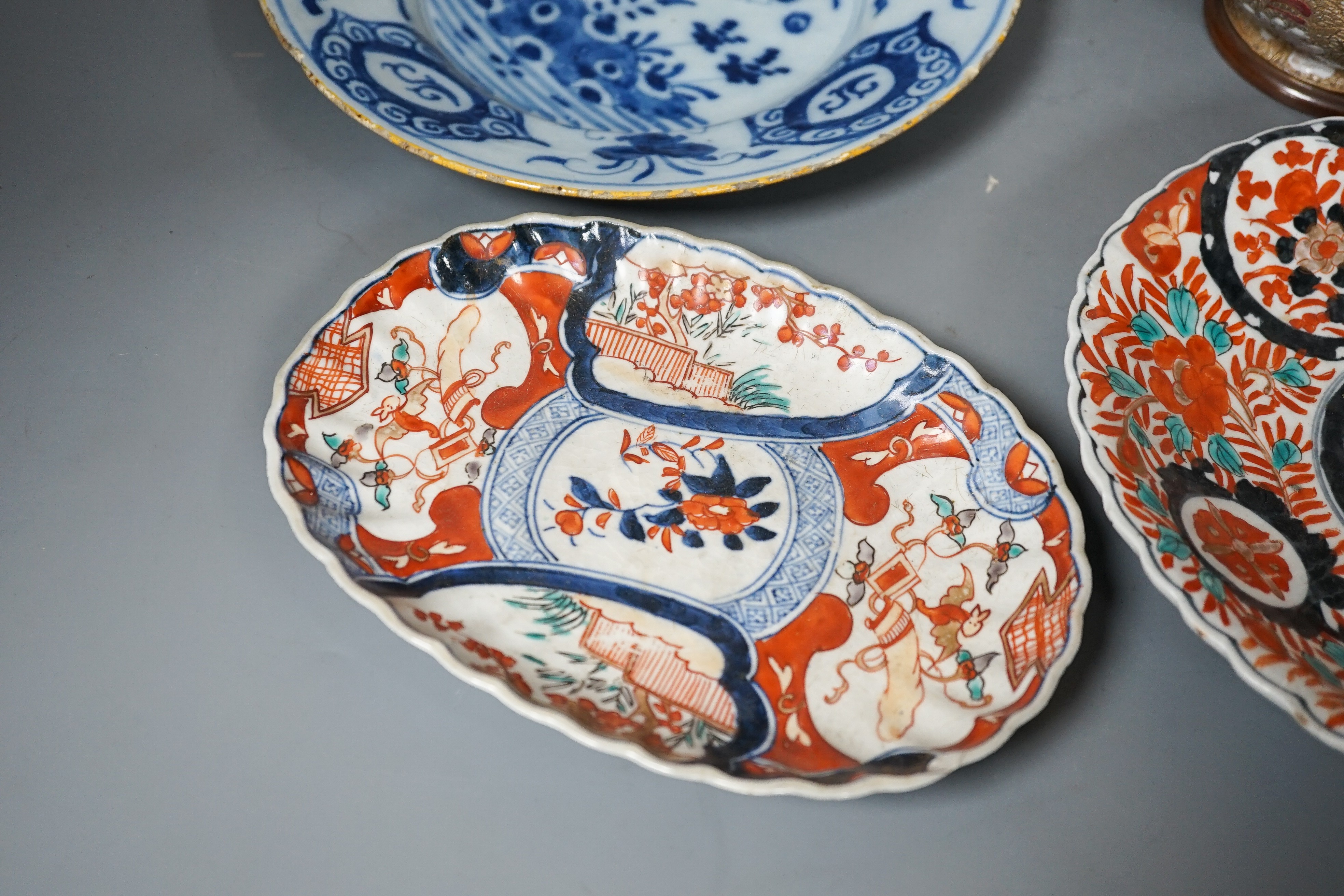 A Doulton slaters patent vase, height 40cm, two Imari dishes and an 18th century Delft blue and white plate